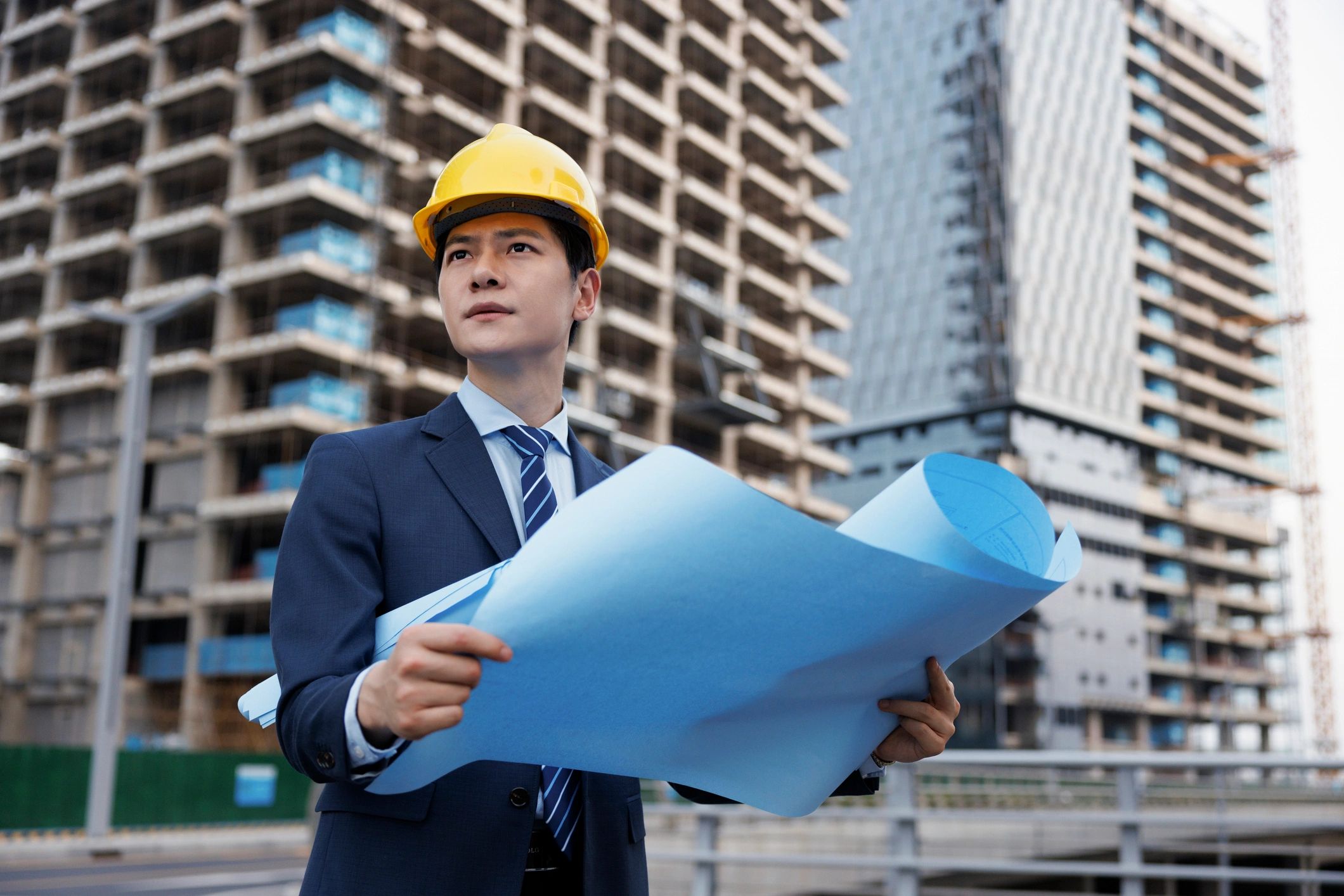 Engineers reviewing construction drawings on site