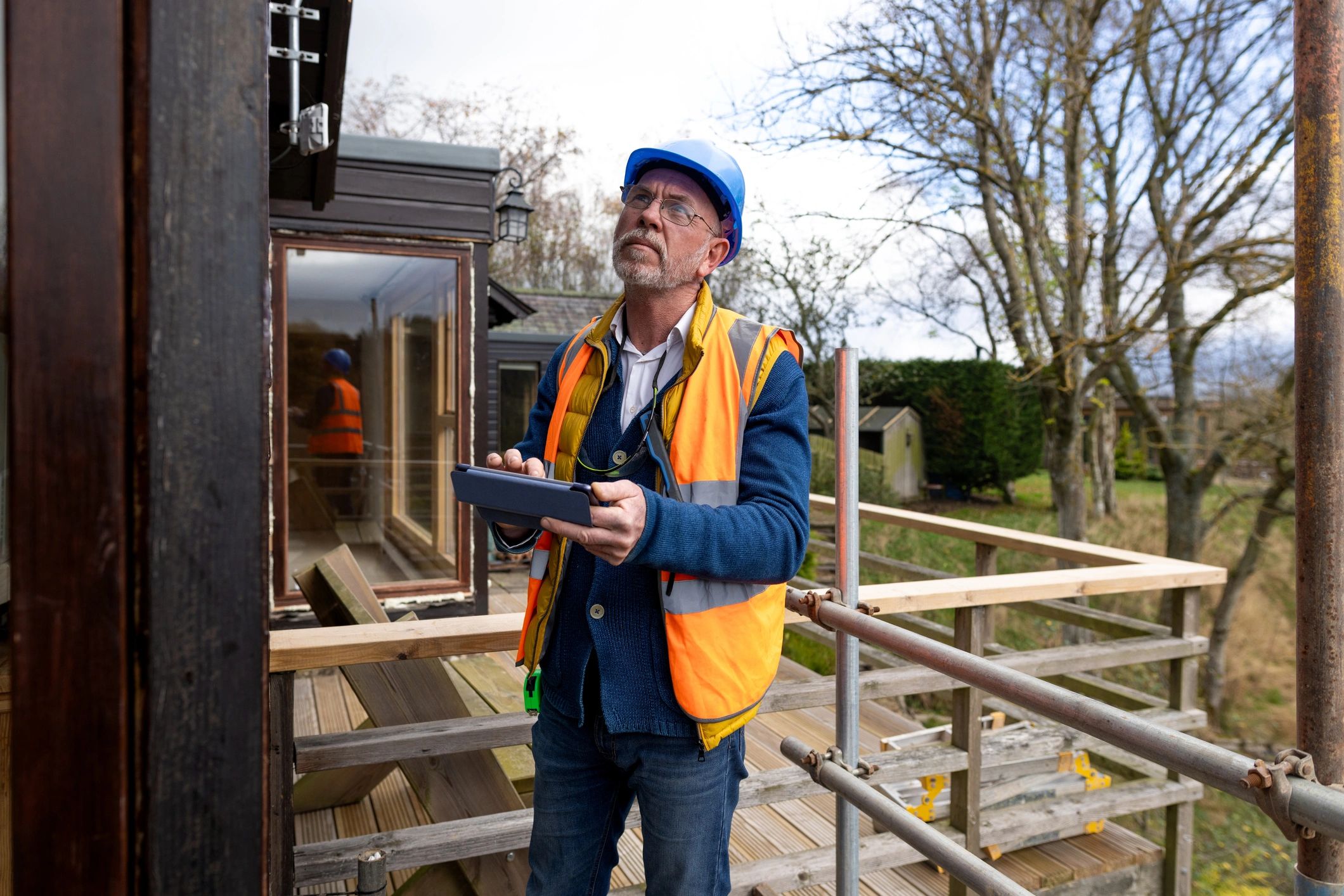 Building inspector documenting findings at a construction site